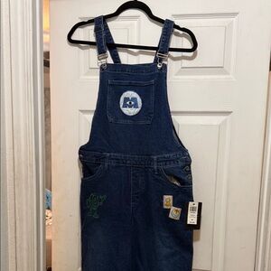 Blue Denim Overalls with Monsters Inc patches. Wide bottoms. Brand new with tags